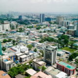 Aerial shot of Lagos showing dense housing areas and city expansion.